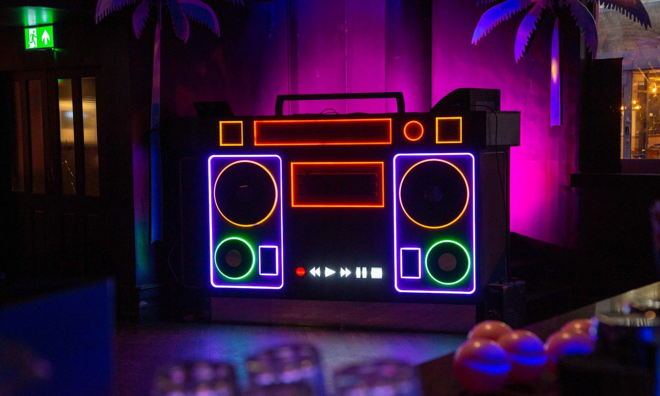 a neon dj booth