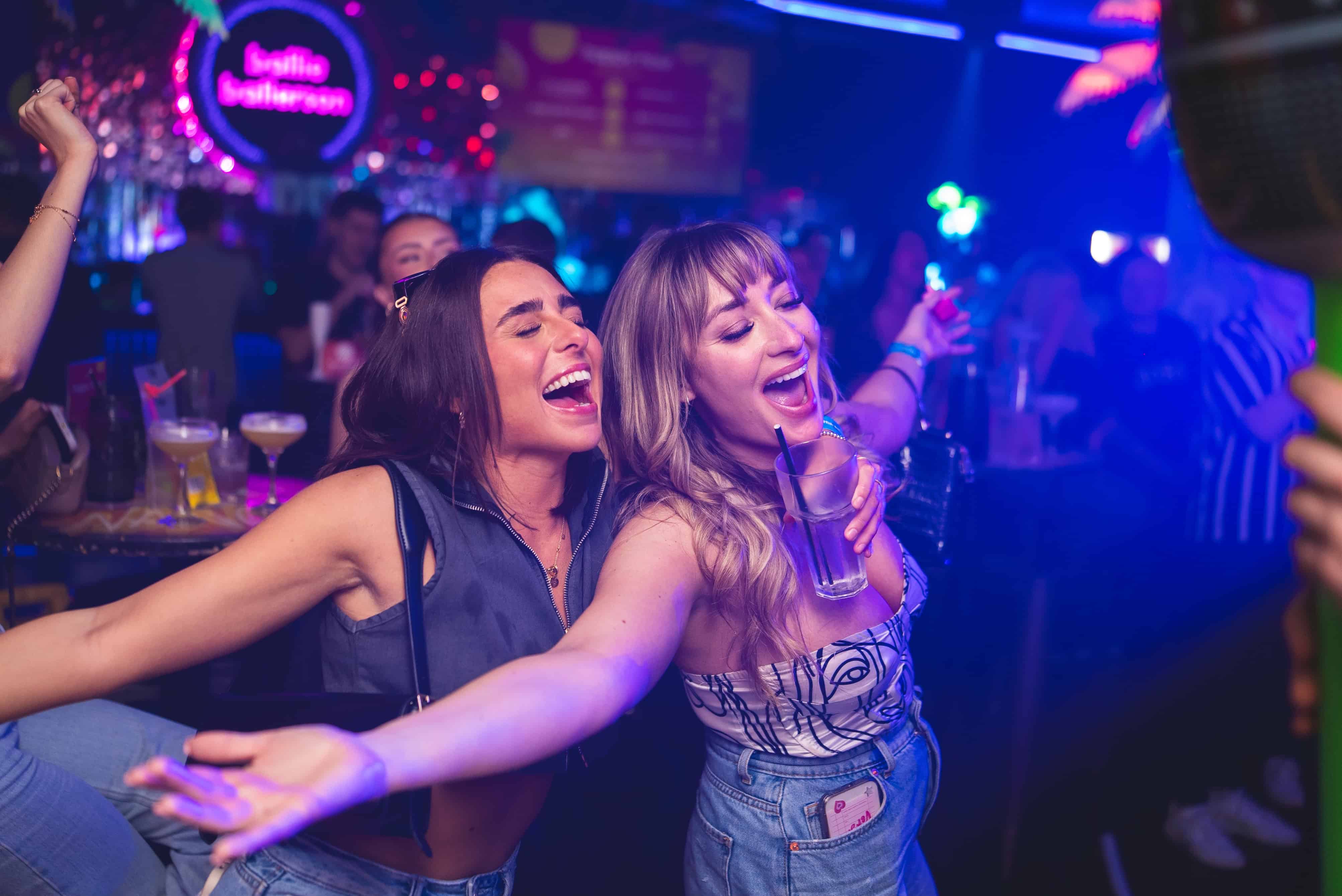 Colourful ball pit at Ballie Ballerson, London’s top bar with neon lights and fun party atmosphere.