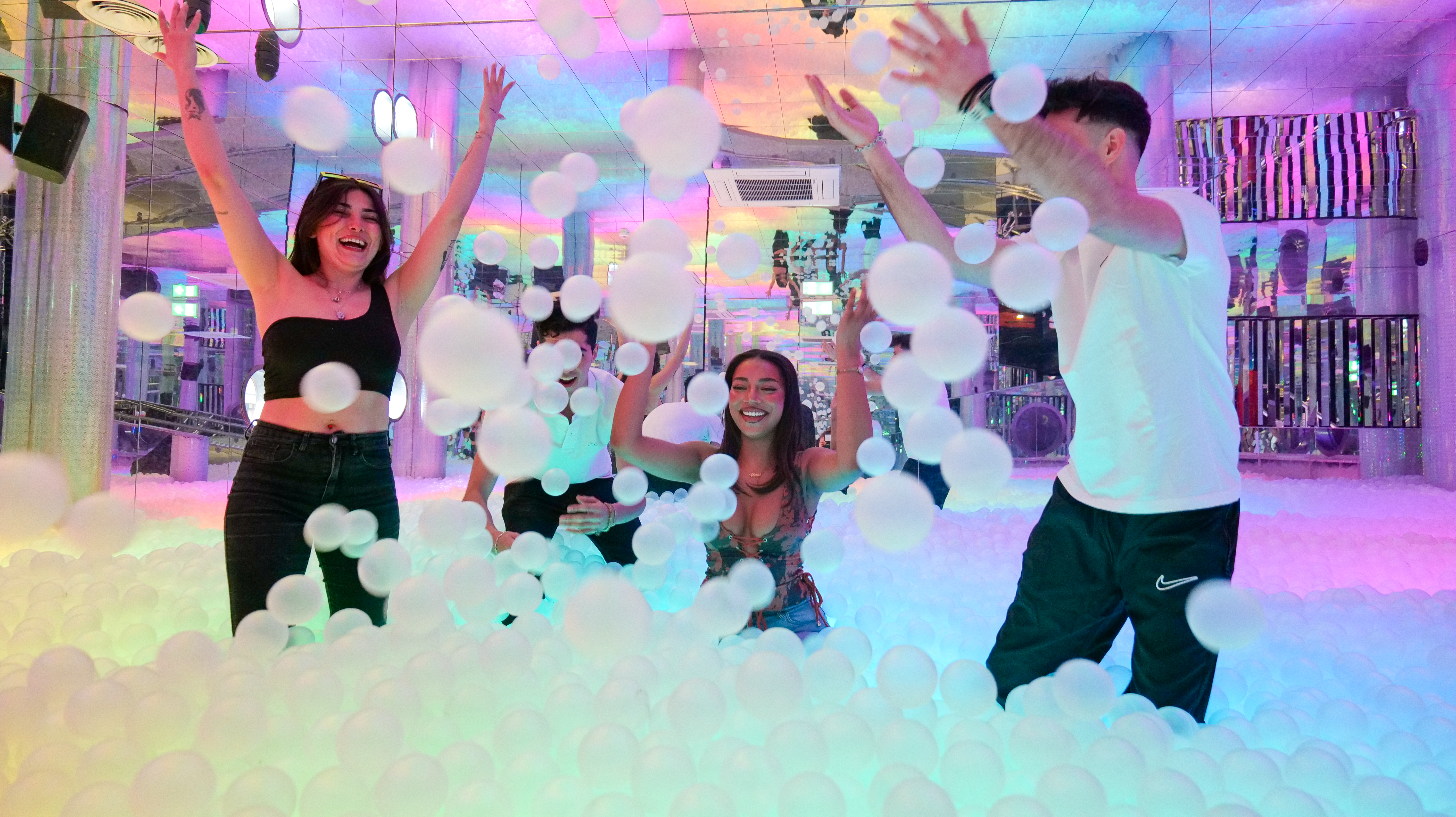 a glowing multicoloured giant ball pit