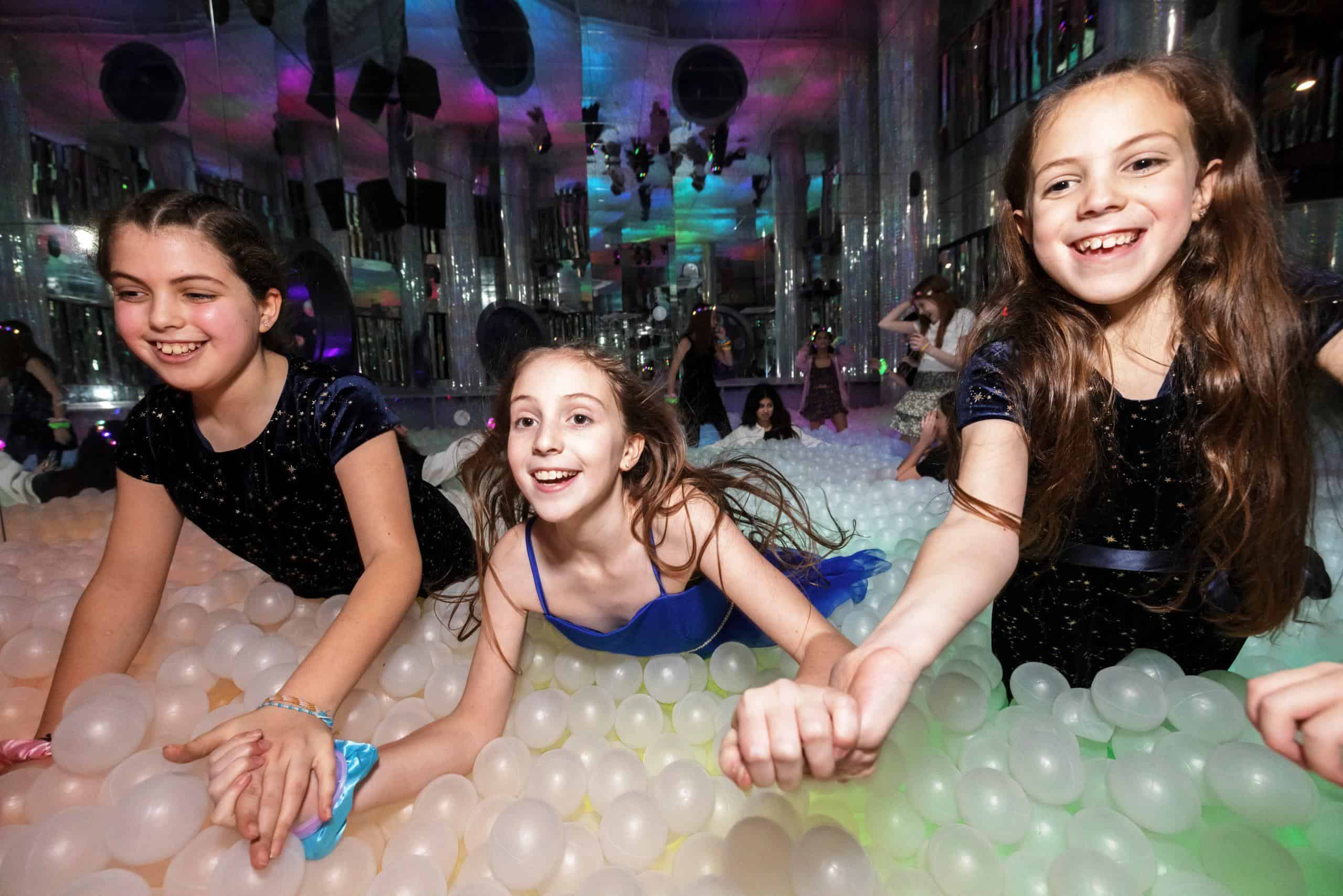 Vibrant indoor ball pit at Ballie Ballerson with children enjoying the colourful spheres.