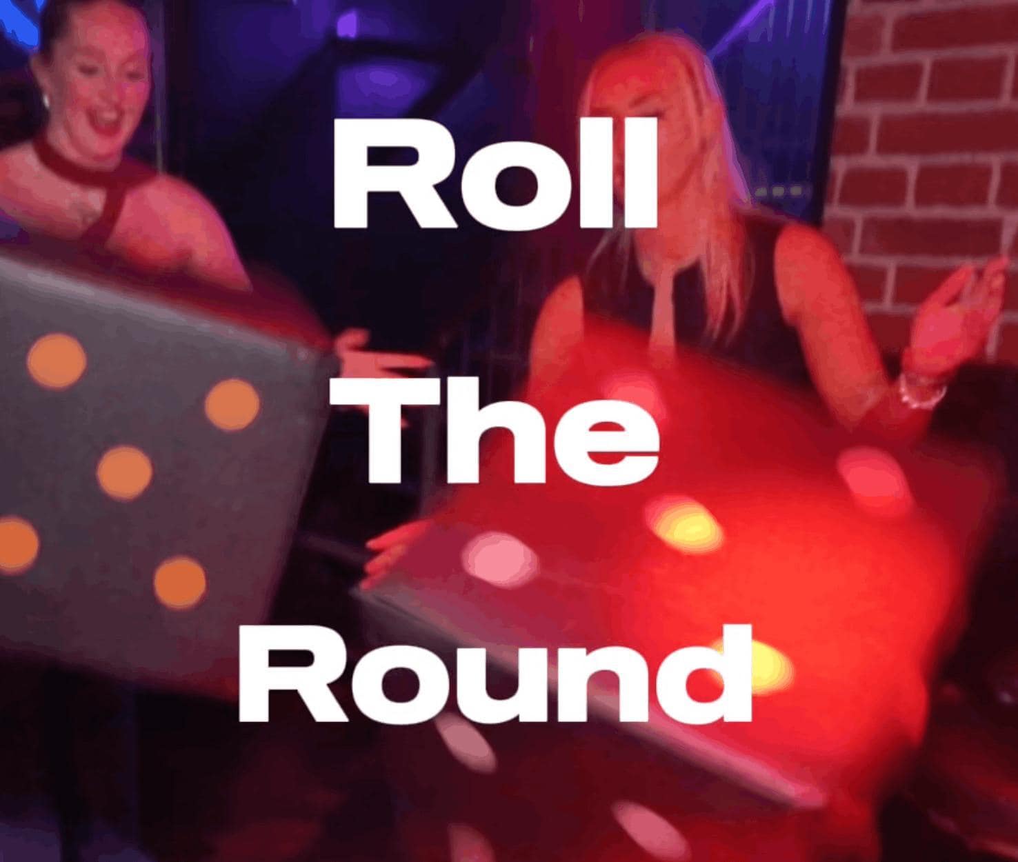 a group of friends drinking prosecco, one man is holding a birthday cake with sparklers sticking out of the top