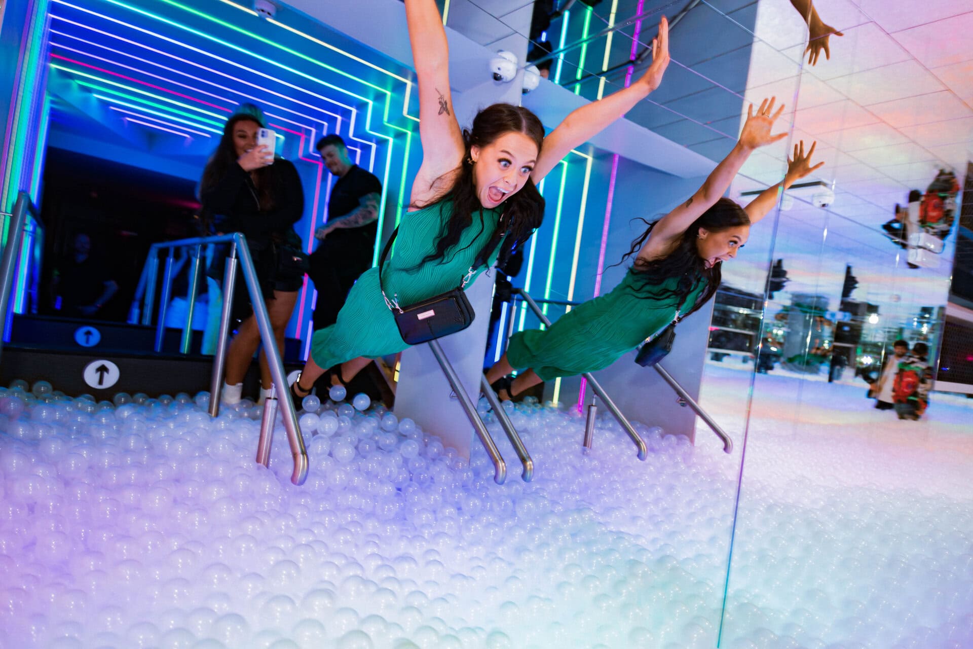 a group of girls playing in a ball pit
